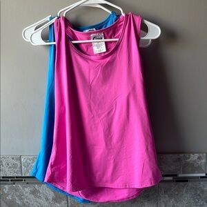 Zyia Women's vented open back tanks in pink and blue.